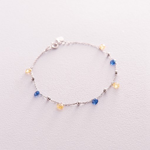 Браслет "Независимая" с шариками в белом золоте (синие и желтые фианиты) б05171