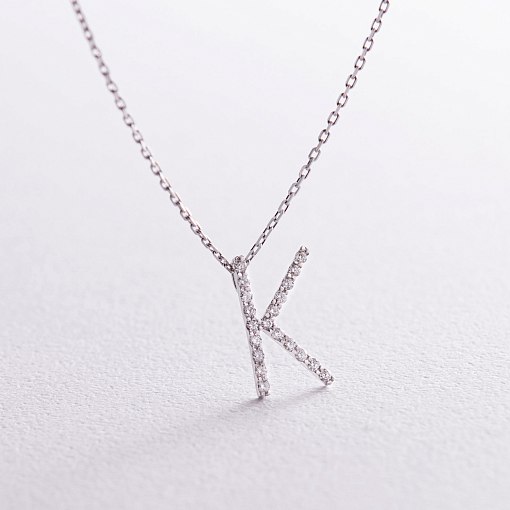 Золоте кольє з літерою 