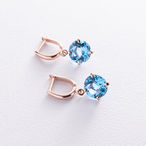 Золотые серьги "Влечение" с голубыми топазами с05295 10