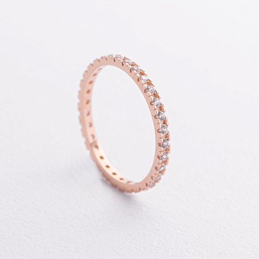 Каблучка з доріжкою каменів в червоному золоті к08277