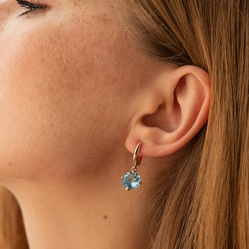 Золотые серьги "Влечение" с голубыми топазами с05295 5