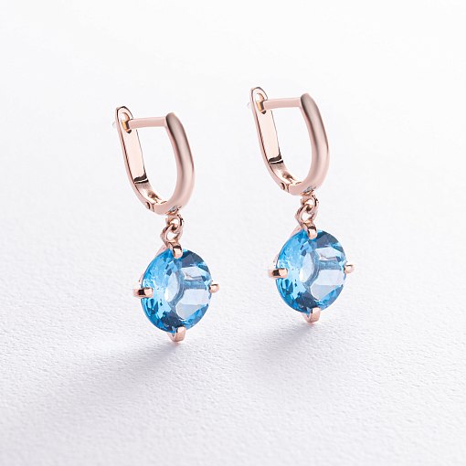 Золотые серьги "Влечение" с голубыми топазами с05295