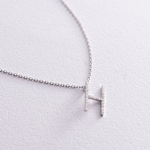 Золоте кольє з літерою 