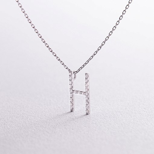 Золоте кольє з літерою 