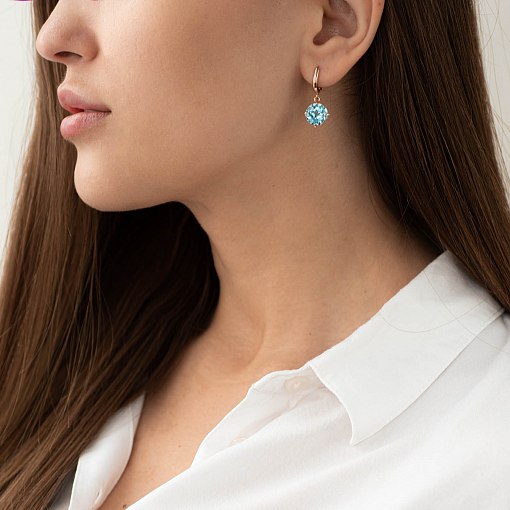 Золотые серьги "Влечение" с голубыми топазами с05295 11