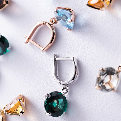 Золотые серьги "Влечение" с голубыми топазами с05295 9