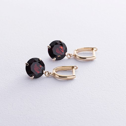 Золотые серьги "Влечение" с пиропом с08699 3