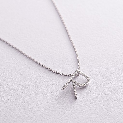 Золоте кольє з літерою 