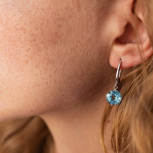 Золотые серьги "Влечение" с голубым топазом с08003 4