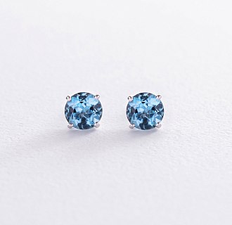 Золоті сережки - пусети з блакитними топазами с08410