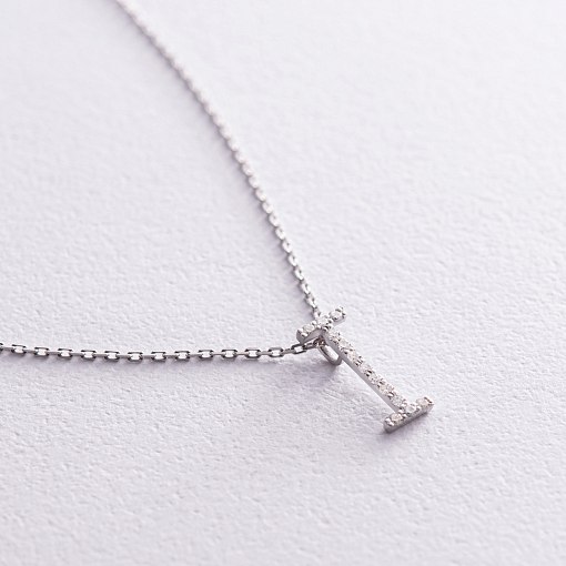 Золоте кольє з літерою 